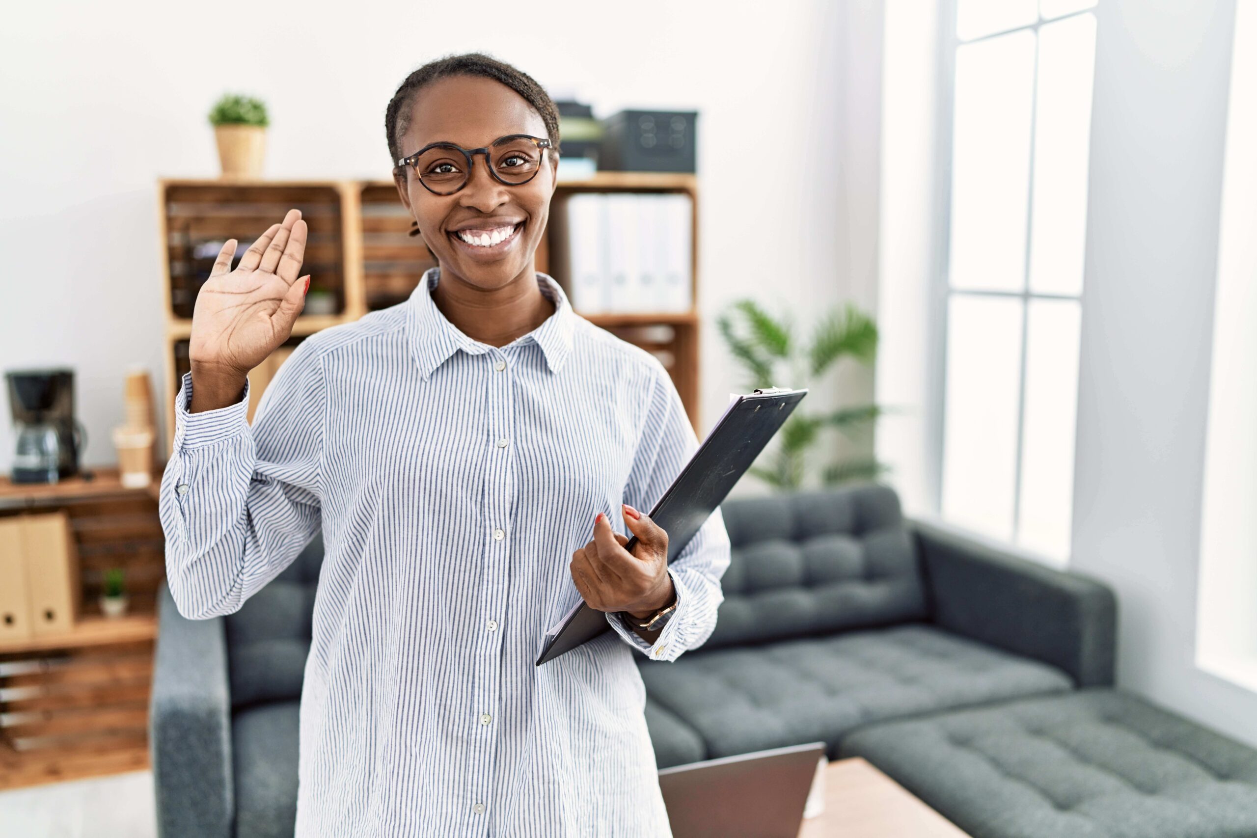 african-woman-psychologist-waving-hello